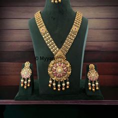 Finest quality antique finish micro gold necklace set with earring and mangtika. This beautiful gold replica chandan haar is made with premium quality gems in ruby and green color with beautiful diamond details in earring.  All orders Ship same day if placed before 4:00 PM EST  Earring Length: 3.5 inch Earring Width: 1.25 inch Mangtika length: 4.5 inch Pendant length: 4 inch Pendant width: 2.75 inch Necklace Length:  26 inch adjustable with dori closure.  Create beautiful memory for any occasion Temple Jewelry Style Kundan Necklace For Wedding, Traditional Antique Gold Bridal Necklace For Wedding, Dual-tone Kundan Temple Jewelry Necklace For Wedding, Antique Kundan Jewelry Sets For Wedding, Antique Gold Chandbali Temple Necklace For Weddings, Dual-tone Kundan Necklace For Wedding In Temple Jewelry Style, Antique Kundan Bridal Necklace Chandbali Style, Antique Kundan Chandbali Bridal Necklace, Antique Kundan Bridal Necklace For Wedding