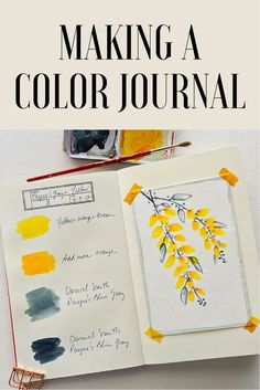 an open book with watercolors on it and the title, making a color journal