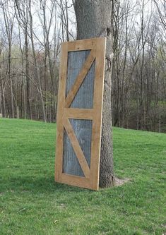 a tree with a barn door attached to it