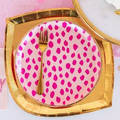 a pink and gold polka dot plate with a fork on it, next to a card that says happy birthday