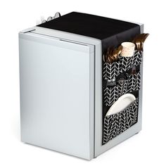 a white and black box with some silver items in it's drawer, on a white background