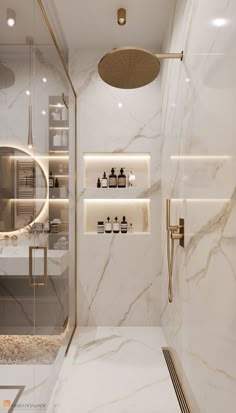 a bathroom with marble walls and flooring, lighted by recessed lighting above the shower