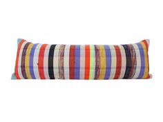 a multicolored striped pillow on a white background