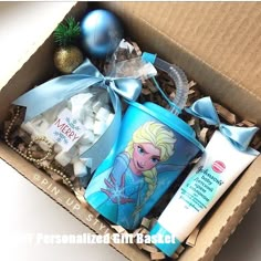 an open box with various items in it including toothpaste, lotion and christmas ornaments