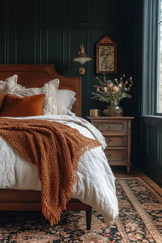 Bohemian bedroom with rich-textured throw blankets for a warm, inviting atmosphere. Dark Boho Minimalist Bedroom, Cozy Art Deco Bedroom, Earthy Dark Academia Bedroom, Dark Terracotta Bedroom, Moody Dark Green Bedroom, Moody Western Bedroom, Vintage Moody Bedroom, Bedrooms With Rugs, Marigold Bedroom