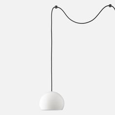 a white light hanging from a black cord