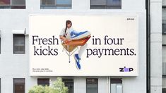 a large advertisement on the side of a building for fresh kicks in four payments