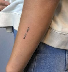 a person with a small tattoo on their arm that says, i am not okay