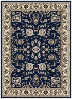 a blue rug with an ornate design on the bottom and beige trimming around it