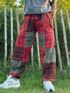 Elevate your festival wardrobe and everyday look with these stunning unisex Hippie Trousers, crafted for ultimate comfort and bohemian flair. Made from sustainable, eco-friendly cotton, these trousers are perfect for anyone who values both fashion and the environment. Whether you're dancing at a festival, flowing through yoga, or embracing your free-spirited lifestyle, these trousers are designed to keep you feeling and looking amazing! Why You'll Love These Trousers? - Unique Striped Stonewashe Bohemian Summer Festival Bottoms, Traditional Summer Festival Bottoms, Hippie Style Relaxed Fit Bottoms For Festival, Casual Boho Print Pants For Festivals, Casual Boho Print Festival Pants, Bohemian Style Relaxed Fit Bottoms, Bohemian Festival Relaxed Fit Pants, Traditional Patchwork Pants For Summer, Bohemian Relaxed Fit Trousers