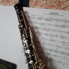 a flute resting on top of sheet music