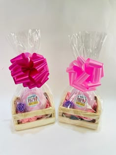 two plastic bags filled with candy sitting on top of each other in front of a white background