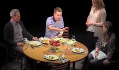 a group of people sitting around a table eating food