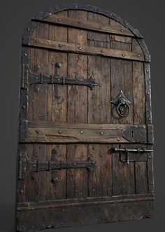 an old wooden door with metal handles