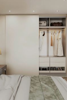 a bedroom with white walls and closets full of clothes