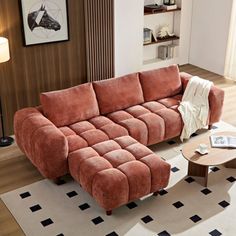 a living room filled with furniture and a rug