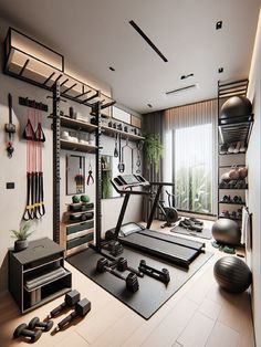 there is a gym with exercise equipment in the room and other things on the floor