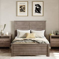 a bed room with a neatly made bed and two pictures on the wall above it