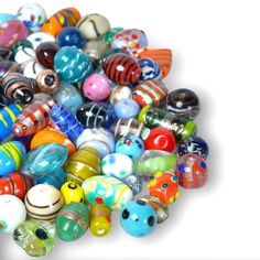 a pile of colorful glass beads sitting on top of each other