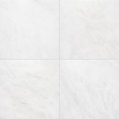 a white tile floor with four different colors