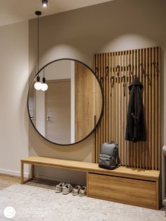 a coat rack and mirror in a room