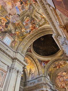 the interior of a church with paintings on the ceiling