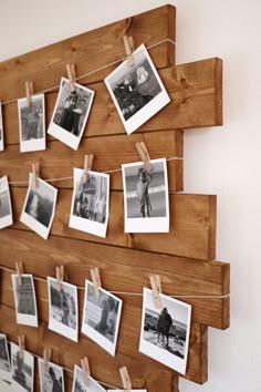 a wooden board with pictures hanging on it