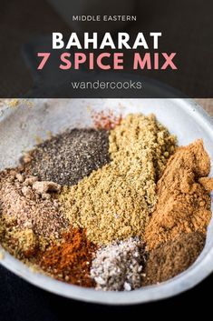 a bowl filled with spices on top of a table