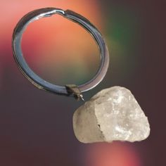 a piece of rock hanging from a metal ring