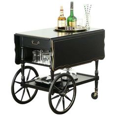 an old fashioned bar cart with drinks on it