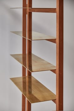 a wooden shelf with three shelves on each side