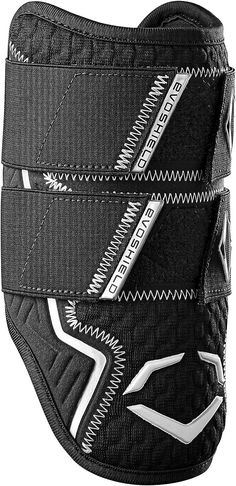 the back side of a black and white motorcycle jacket with zippers on it's sides