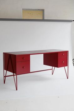 a red and white desk with two drawers