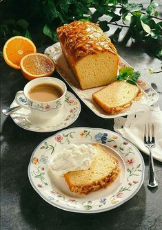 a loaf of bread sitting on top of a plate next to a cup of coffee