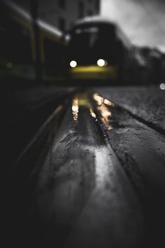 a black and white photo of a train at night