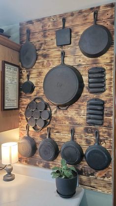 pots and pans are hanging on the wall