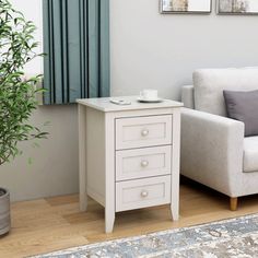 a living room with a couch, chair and side table