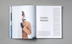 an open magazine with a woman wearing gloves