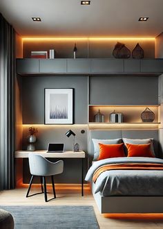 a bedroom with grey walls and orange pillows on the bed, along with an office desk