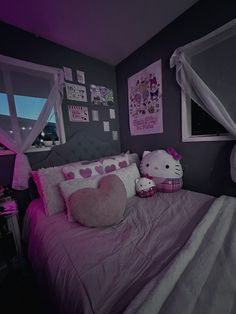 a hello kitty themed bedroom with purple walls