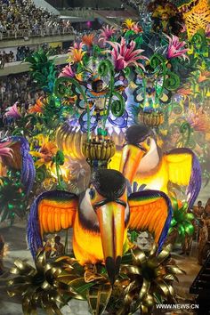 an elaborate float with birds and flowers on it