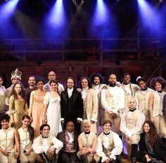 a group of people standing on top of a stage