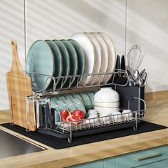 the dish rack is full of dishes and utensils