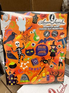 an orange box with halloween stickers on it