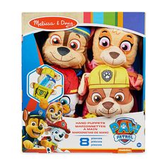 two stuffed animals are in the packaging for this toy story book, which features paw patrol characters