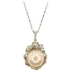 Introducing our Vintage Baroque Style 14mm Mabé Pearl Necklace Pendant in Sterling Silver, a stunning piece that showcases the timeless elegance of a lustrous Mabé Pearl in a unique and intricate design. At the center of this pendant rests a stunning creamy white Mabé Pearl, boasting a smooth and lustrous surface. With its shimmering iridescence and creamy white appearance, this pearl exudes timeless charm and sophistication. Each pearl is carefully selected for its exceptional quality, ensuring Pearl Vintage Necklace, Bridgeton Dresses, Mabe Pearl Necklace, Baroque Necklace, Pearl Necklace Pendant, Vintage Pearl Necklace, Diamond Pendants Designs, Pearl Necklace Vintage, Mabe Pearl