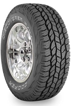 an all terrain tire with chrome rim and chrome spokes, on a white background