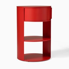 a red shelf with two shelves on each side