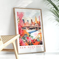 a wooden chair sitting next to a poster on the wall in front of a potted plant