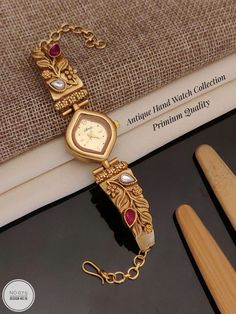 Description :- Vintage Women Watch, Ladies Wrist Watch, Gift For Her, Vintage Watch, Women's Watch, Classic Retro Jewelry, Elegant Gift For Her Gift yourself a royal look with this perfectly crafted kundan necklace set from Manalisstudio. Crafted with high quality, it is impressive in design. The green enamel artwork adds perfect texture to the design. Perfect for weddings and festivities, this antique necklace set should be put on with your favorite sari or lehenga. 100% Satisfaction. Long Lasting Plating, High-Quality Stones. Gifting :- This Bracelets Watch comes in a beautiful manalisstudio gift box, making it an ideal gift for birthdays, weddings or anniversaries. Occasion :- Perfect choice for any Indian occasion. Care :- It is advisable that you keep Manalis products away from direct Bracelets Watch, Antique Necklace Set, Ladies Wrist Watch, Watch Women's, Kundan Necklace Set, Vintage Watches Women, Gift Box Making, Watch Gift, Royal Look